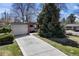 Home exterior with a well-maintained lawn, driveway, and curb appeal at 1400 E Bates Ave, Englewood, CO 80113