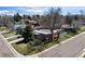 Charming single-story home with a modern design, mature trees and well-manicured lawn at 1400 E Bates Ave, Englewood, CO 80113