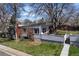 Stunning exterior view of home, with a modern design and mature trees, nestled in a quiet neighborhood at 1400 E Bates Ave, Englewood, CO 80113