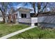 A charming single-story home featuring a private entry and well-kept lawn at 1400 E Bates Ave, Englewood, CO 80113