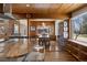 Spacious kitchen with a view into the dining room, showcasing hardwood floors and ample natural light at 1400 E Bates Ave, Englewood, CO 80113