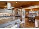 Gourmet kitchen with granite countertops, stainless steel appliances, open to dining room and seating at 1400 E Bates Ave, Englewood, CO 80113
