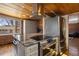 Well-equipped kitchen featuring stainless steel appliances, granite countertops, and custom cabinetry, ideal for cooking at 1400 E Bates Ave, Englewood, CO 80113
