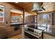 Modern kitchen with stainless steel appliances, granite countertops, and a view of the dining area at 1400 E Bates Ave, Englewood, CO 80113
