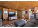 Living room featuring wood ceilings, a TV console, hardwood floors and an open floor plan at 1400 E Bates Ave, Englewood, CO 80113