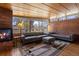 Bright living room boasting a brick accent wall, fireplace, large windows and cozy seating at 1400 E Bates Ave, Englewood, CO 80113