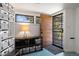 Charming mud room with convenient shoe storage, bins, and a stylish geometric-patterned floor at 1400 E Bates Ave, Englewood, CO 80113