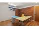 Office featuring hardwood floors, exposed brick, and a sewing table at 1400 E Bates Ave, Englewood, CO 80113