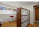 Room featuring a large storage closet, hardwood floors, and recessed lighting at 1400 E Bates Ave, Englewood, CO 80113