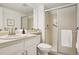 Neutral bathroom featuring a shower, vanity and tiled walls at 8335 Fairmount Dr # 5-106, Denver, CO 80247