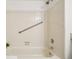 Bathroom with a neutral tub and shower combo with chrome grab bar at 8335 Fairmount Dr # 5-106, Denver, CO 80247