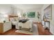 Bedroom featuring stylish decor, natural light and hardwood flooring at 8335 Fairmount Dr # 5-106, Denver, CO 80247