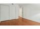 Bedroom with hardwood flooring and a closet with sliding doors at 8335 Fairmount Dr # 5-106, Denver, CO 80247