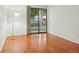 Bedroom with hardwood flooring and sliding glass doors opening to the outside at 8335 Fairmount Dr # 5-106, Denver, CO 80247