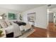 Bedroom featuring stylish decor, natural light and hardwood flooring at 8335 Fairmount Dr # 5-106, Denver, CO 80247