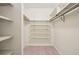Walk-in closet featuring shelves all around and tile flooring at 8335 Fairmount Dr # 5-106, Denver, CO 80247