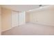 Spacious basement area with neutral carpet and large closet at 7700 E Oxford Ave, Denver, CO 80237