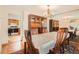 Elegant dining room featuring classic wood furniture, a chandelier, and hardwood floors at 7700 E Oxford Ave, Denver, CO 80237