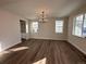 Bright dining room with hardwood floors and chandelier at 5503 Riverbend Ave, Firestone, CO 80504