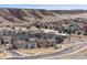 This aerial shot shows the neighborhood, with scenic mountain views in the background at 2464 Garganey Dr, Castle Rock, CO 80104