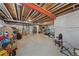 Unfinished basement with a partial wall, mechanicals, and a workbench at 2464 Garganey Dr, Castle Rock, CO 80104