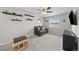 Bonus room with carpeted floors, black shelves, and a view of the outdoors at 2464 Garganey Dr, Castle Rock, CO 80104