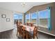 Dining room with hardwood floors, large windows, and a sliding door to the outside at 2464 Garganey Dr, Castle Rock, CO 80104