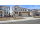 Inviting two-story home with a well-kept lawn and neutral-toned siding at 2464 Garganey Dr, Castle Rock, CO 80104