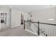 Second story hallway leading to bedrooms and bathrooms with view of staircase at 2464 Garganey Dr, Castle Rock, CO 80104