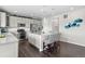 Modern kitchen with stainless steel appliances, a center island, and hardwood floors at 2464 Garganey Dr, Castle Rock, CO 80104