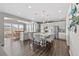 Spacious kitchen with an island, modern appliances, and an adjacent dining area at 2464 Garganey Dr, Castle Rock, CO 80104