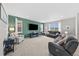 Spacious living room with a large sectional sofa and natural light at 2464 Garganey Dr, Castle Rock, CO 80104