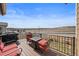 Exterior view of the patio with a grill, chairs, and views of the surrounding neighborhood at 2464 Garganey Dr, Castle Rock, CO 80104