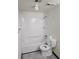 Bathroom view with a white shower and tub combination, a toilet, and a towel rack at 7665 E Eastman Ave # 104A, Denver, CO 80231