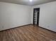 Bedroom with an open closet with laminate flooring at 7665 E Eastman Ave # 104A, Denver, CO 80231