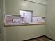 Kitchen with white appliances and cabinets and new flooring at 7665 E Eastman Ave # 104A, Denver, CO 80231