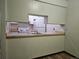 Kitchen view showing an open layout with a sink, breakfast bar, and appliances at 7665 E Eastman Ave # 104A, Denver, CO 80231