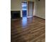 Spacious living room featuring hardwood floors and a fireplace, with lots of natural light at 7665 E Eastman Ave # 104A, Denver, CO 80231