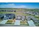 Stunning aerial view of a suburban neighborhood, displaying single-Gathering homes with generous lot sizes and open spaces at 14337 Shasta Daisy Pt, Parker, CO 80134