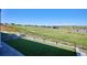 Inviting backyard featuring manicured artificial turf, a walking path, and unobstructed views of the surrounding landscape at 14337 Shasta Daisy Pt, Parker, CO 80134