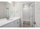 Clean bathroom featuring white cabinets and counter, with a view of the tiled shower and tub at 14337 Shasta Daisy Pt, Parker, CO 80134