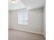 Bright bedroom with neutral carpet, white walls, and a window providing natural light at 14337 Shasta Daisy Pt, Parker, CO 80134