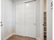 Spacious closet with sliding doors and built-in shelving, perfect for organized storage at 14337 Shasta Daisy Pt, Parker, CO 80134