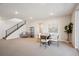 Finished basement with stairs, neutral carpet, bathroom access, and a comfortable living space at 14337 Shasta Daisy Pt, Parker, CO 80134
