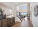 Inviting foyer with high ceilings, hardwood floors, and a staircase leading to the upper level at 14337 Shasta Daisy Pt, Parker, CO 80134
