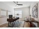 Modern home office featuring a stylish desk, comfortable chair, and contemporary decor at 14337 Shasta Daisy Pt, Parker, CO 80134
