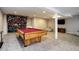 Finished basement with a pool table, climbing wall, and seating at 3080 E Geddes Pl, Centennial, CO 80122