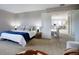 Spacious bedroom with plush carpeting and access to a loft at 3080 E Geddes Pl, Centennial, CO 80122