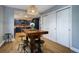 Kitchen features a dining area with a rustic wooden table and industrial stools at 3080 E Geddes Pl, Centennial, CO 80122