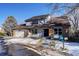 Two-story home with brick and siding, attached garage, and landscaping at 3080 E Geddes Pl, Centennial, CO 80122